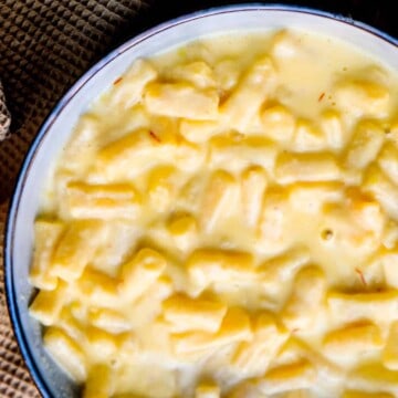 A big bowl of creamy macaroni and cheese with saffron.
