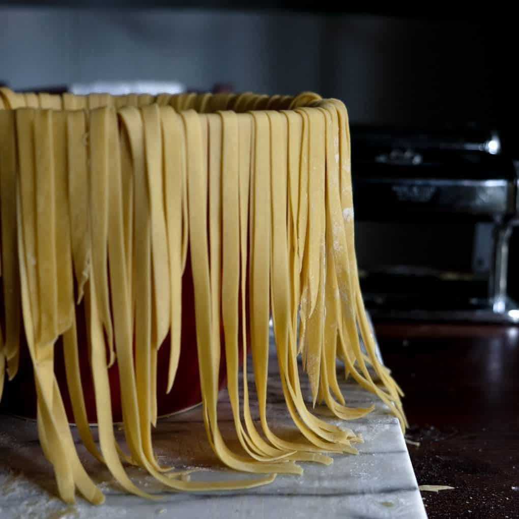 Handmade fettuccini pasta resting before cooking