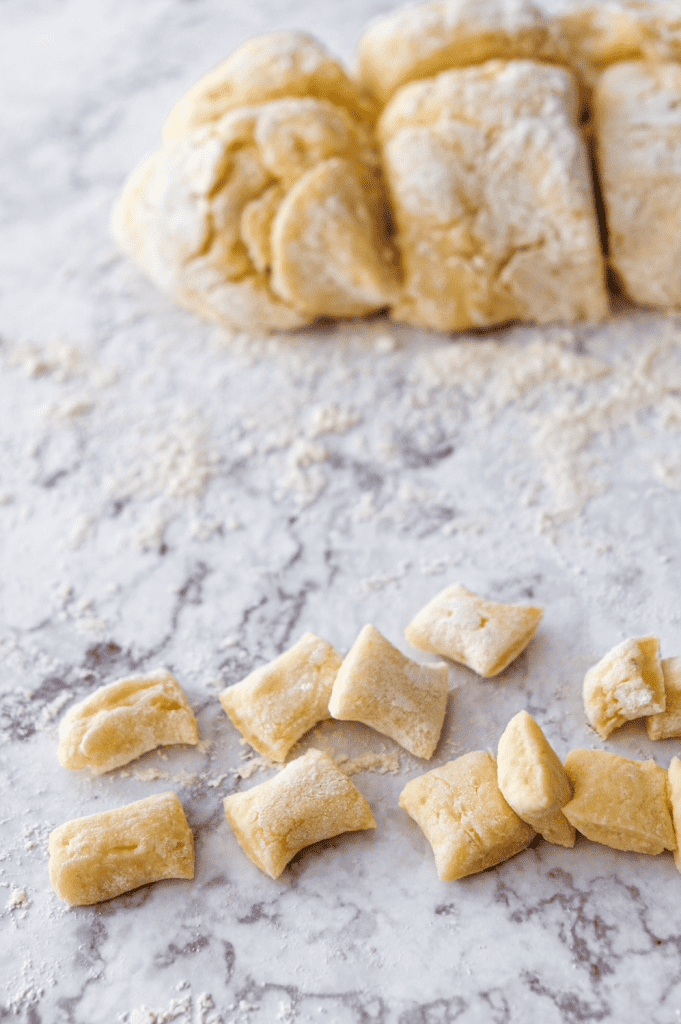 Shaping homemade potato gnocchi.