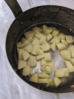 Boiling potatoes for homemade potato gnocchi.