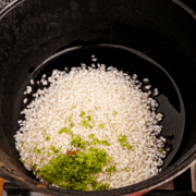 Preparing coconut lime rice with cilantro and black beans