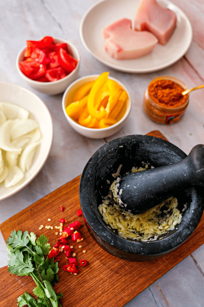 Preparing coconut curry sauce for seared tuna steaks.