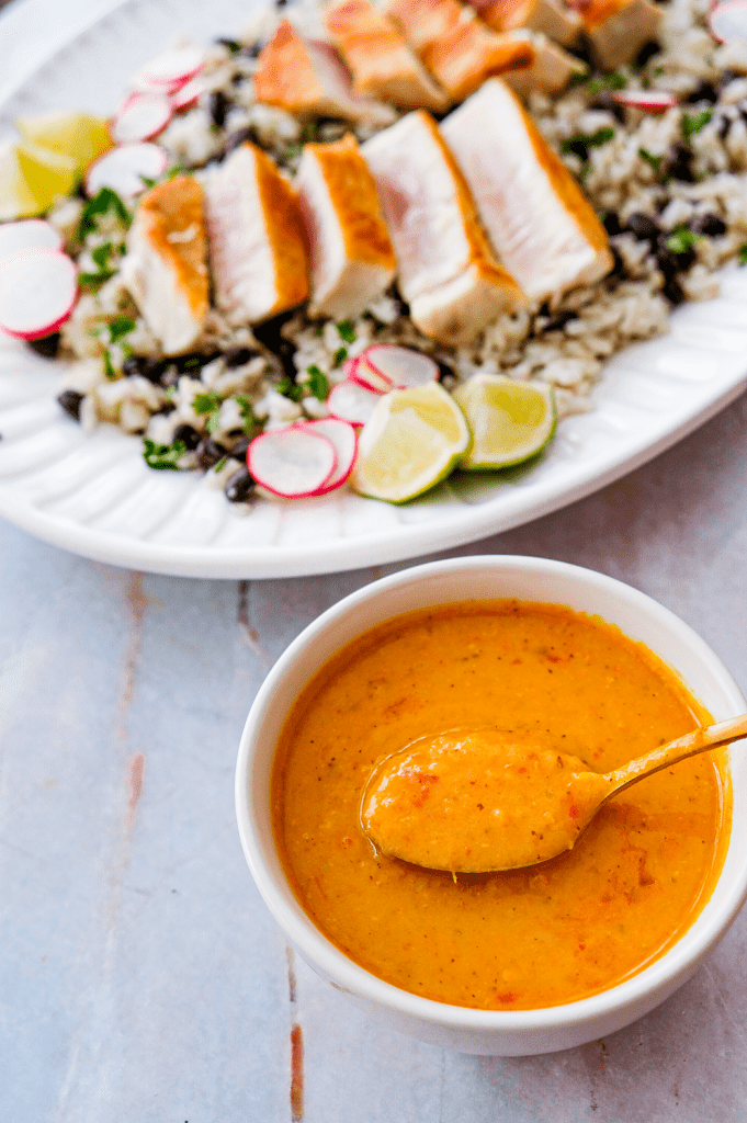 Seared tuna steaks with creamy coconut curry sauce and cilantro lime rice