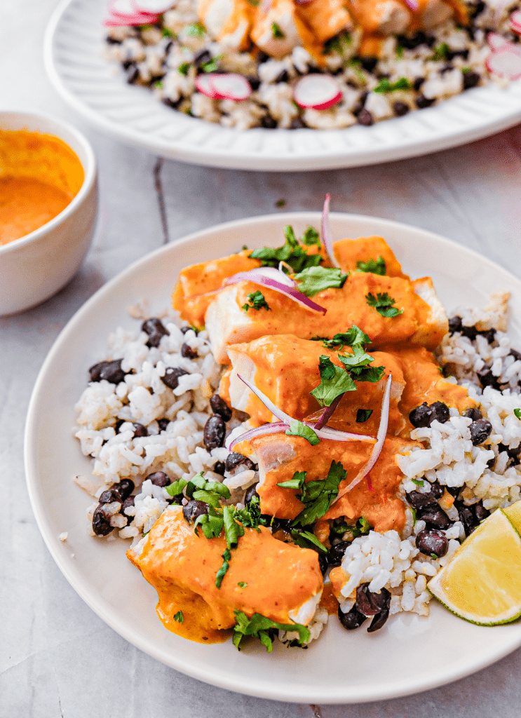 Seared tuna steaks with creamy coconut curry sauce and cilantro lime rice