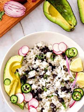 Coconut lime rice with cilantro and black beans plus yummy additions of jalapenos, radishes, and avocado.