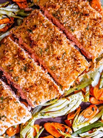 Easy sheet pan roasted salmon, fennel and carrot with yogurt dill sauce.