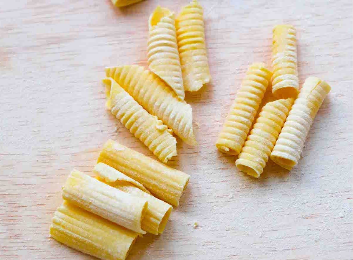 Fresh rigatoni and garganelli pasta shapes.