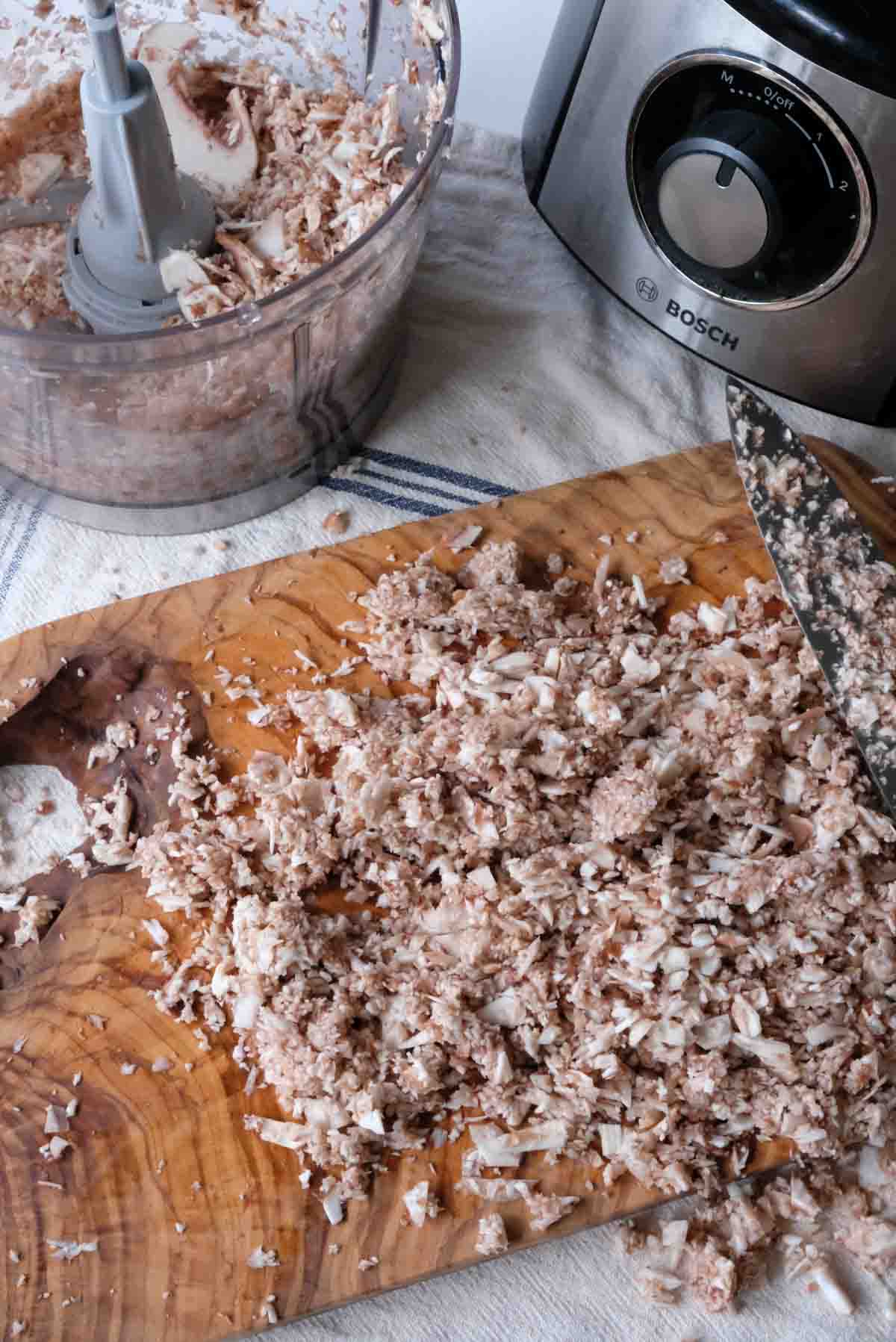 Mushrooms that have been chopped with a food processor. They are cut into much finer pieces than if they had been cut with a knife.