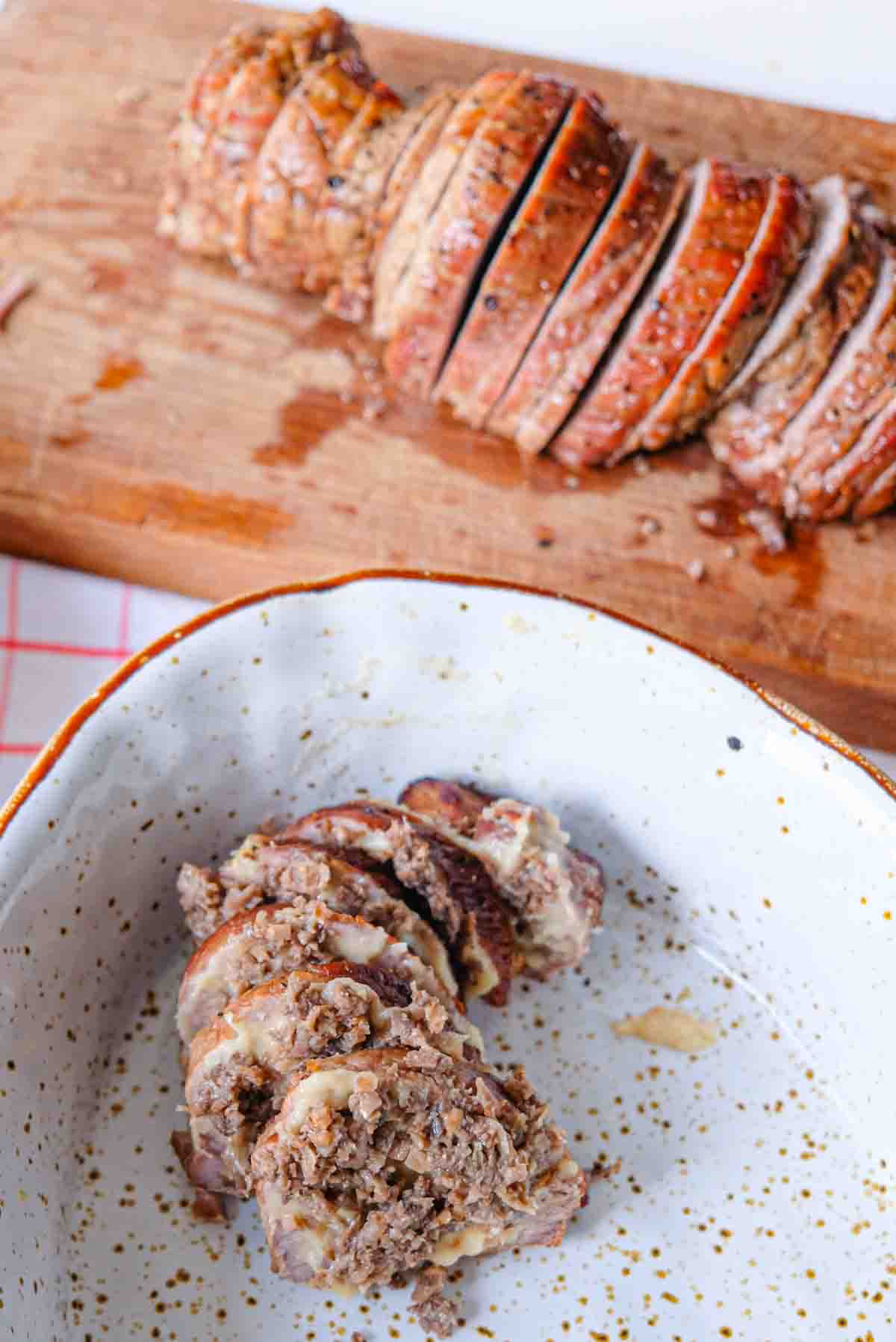 Thinly sliced veal being stuffed with chestnut mushroom duxelles and onion soubise sauce.