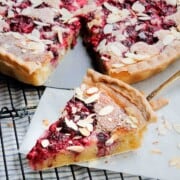 slice of raspberry frangipane tart with filling visible
