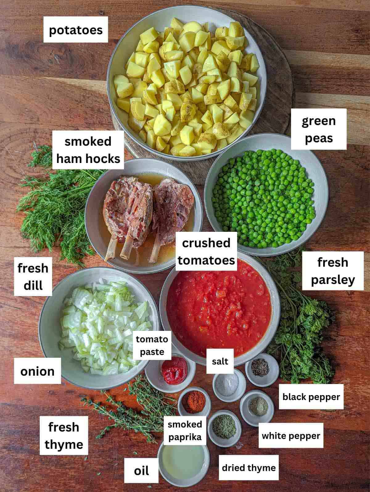 Ingredients for potato stew with green peas and smoked ham hocks.