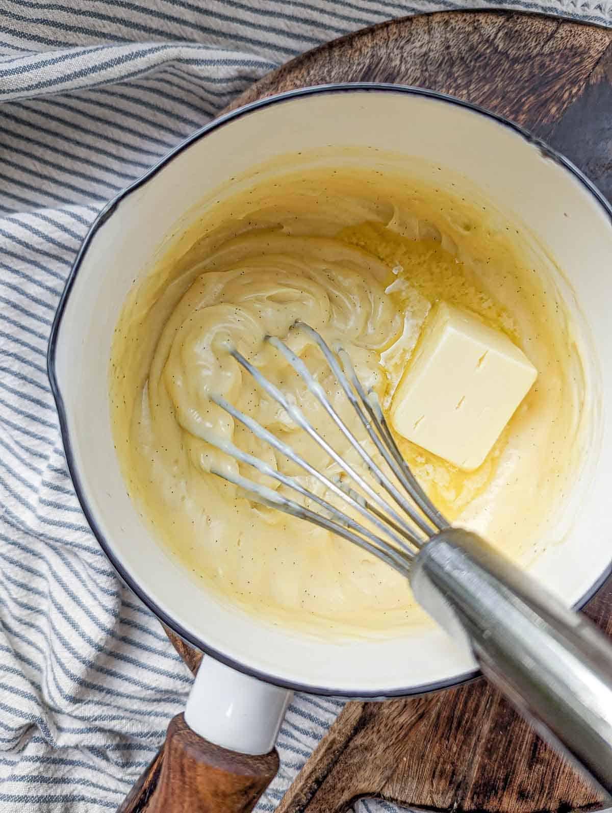 Mixing butter into pastry cream.