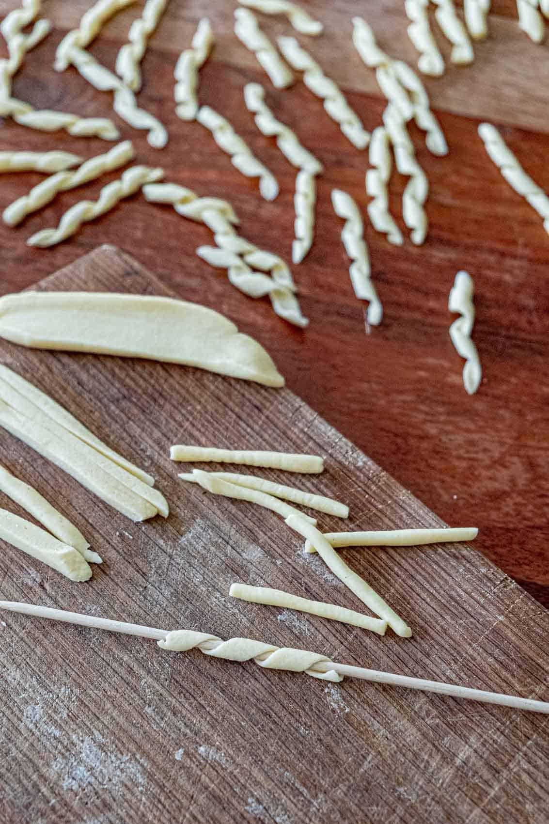 Using a small wooden skewer to make fusilli al ferretto.