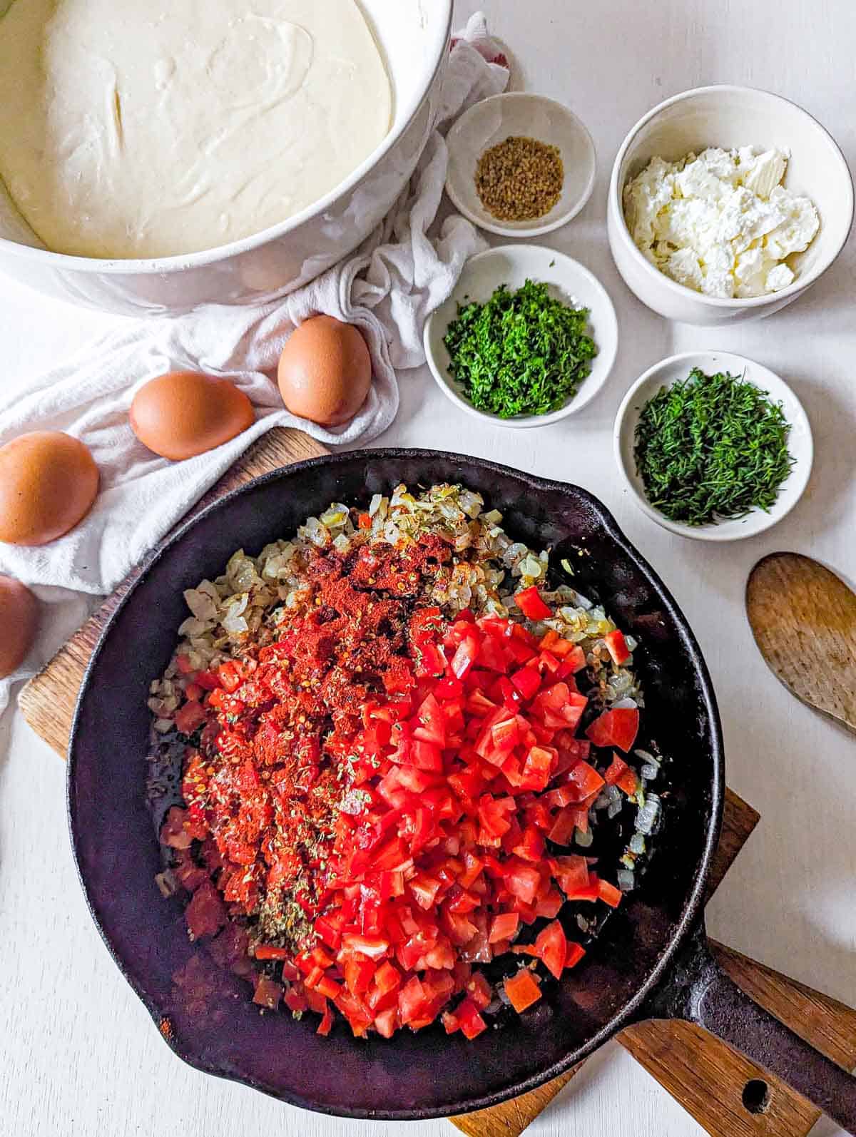 sauteed onion and cumin seeds with red pepper for shakshuka