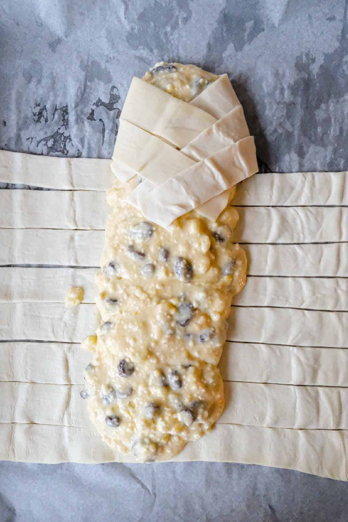 the filling added to the puff pastry before folding the edges in