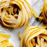 Nests of fresh made tagliatelle pasta.