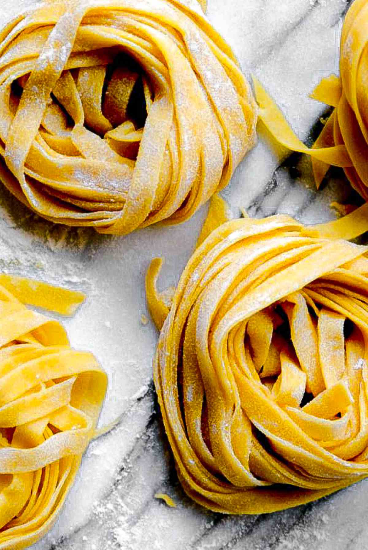 Nests of fresh made tagliatelle pasta.