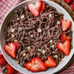 close up chocolate fettucine with strawberries