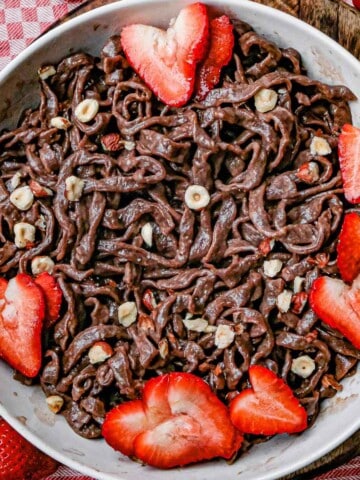 close up chocolate fettucine with strawberries