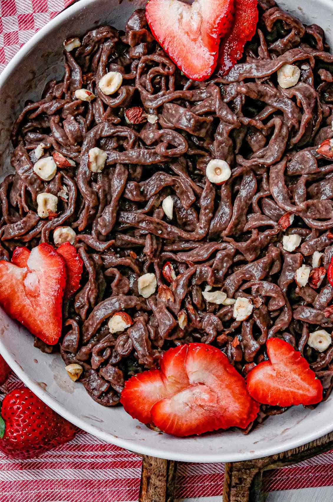 close up nutella noodles with strawberry hearts