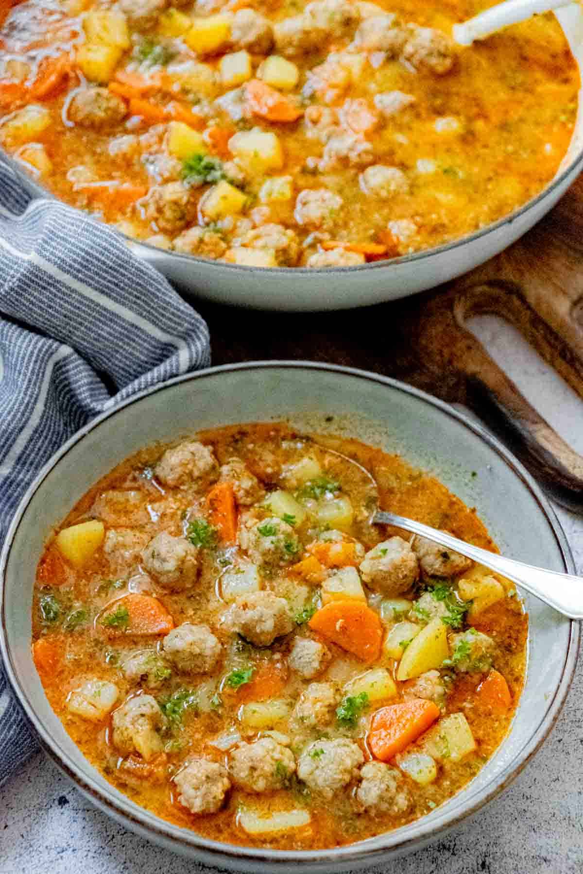 serving turkish meatball soup