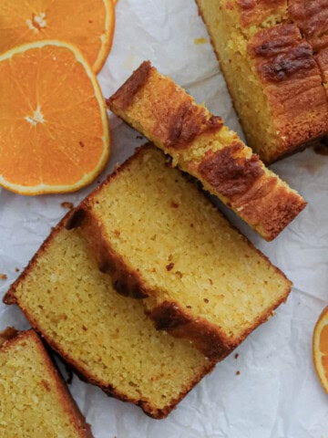 Slices of orange cake on a white paper