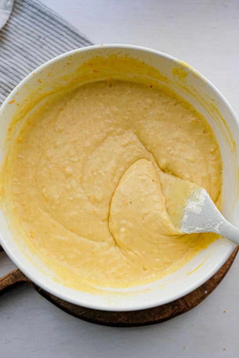 Loaf cake batter being stirred to show consistency.