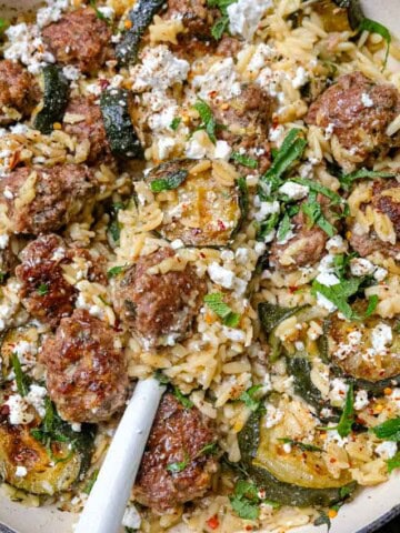 herby meatballs with zucchini and feta cover