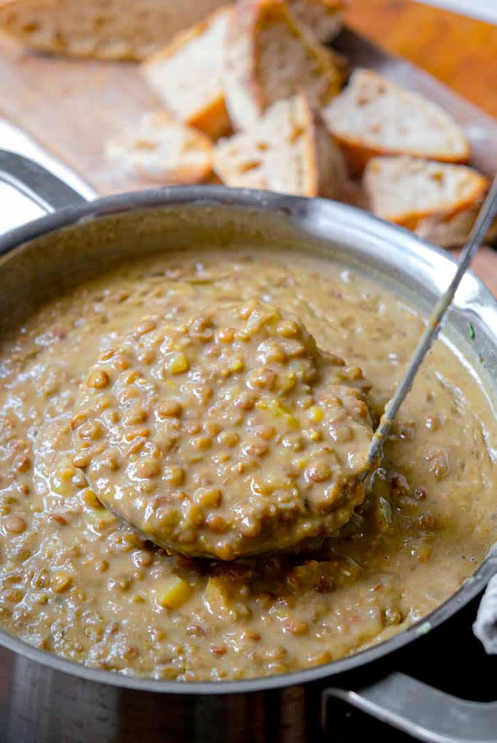 lentil soup with potatoes in ladle
