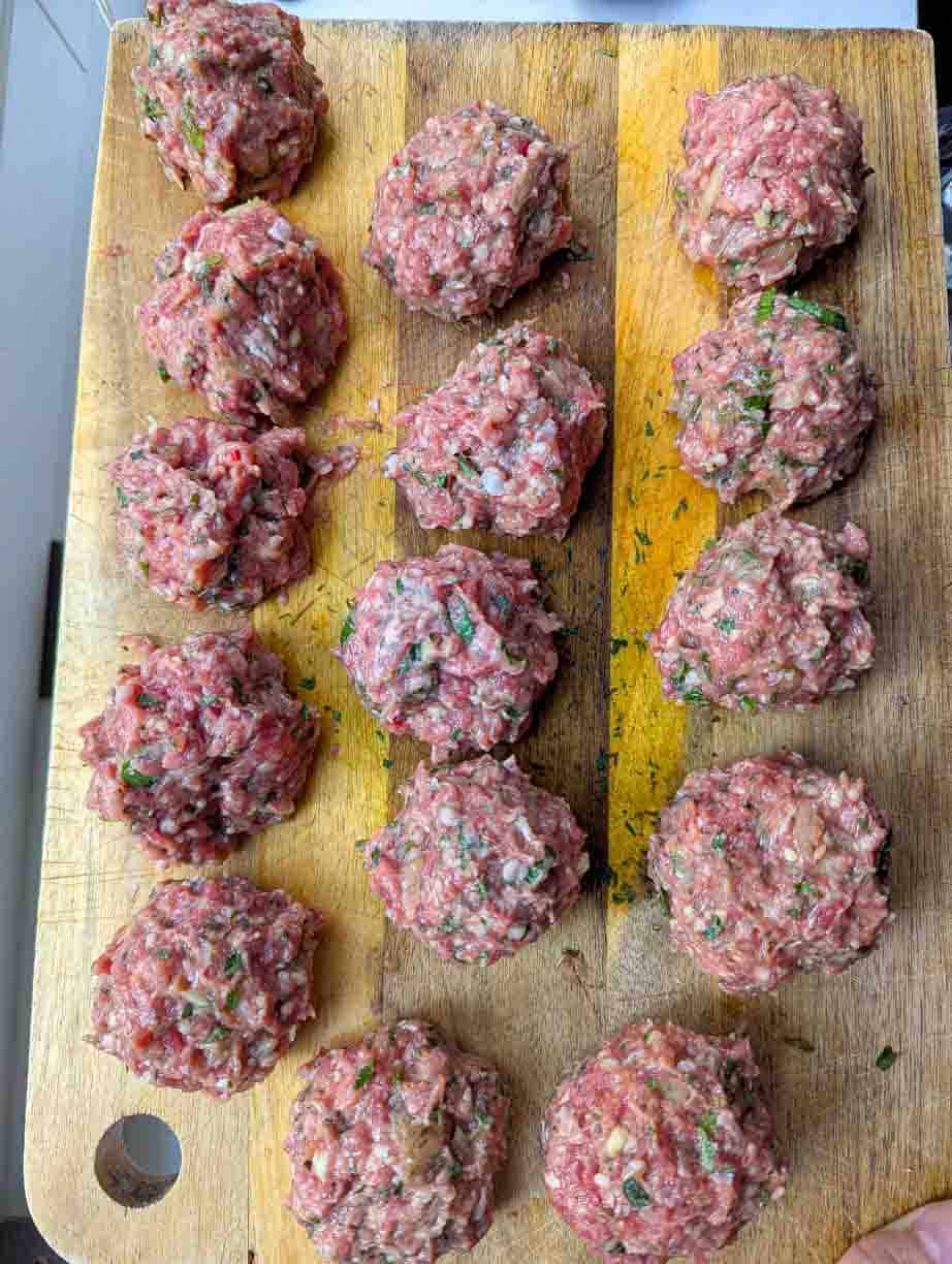 shaped meatballs on cutting board