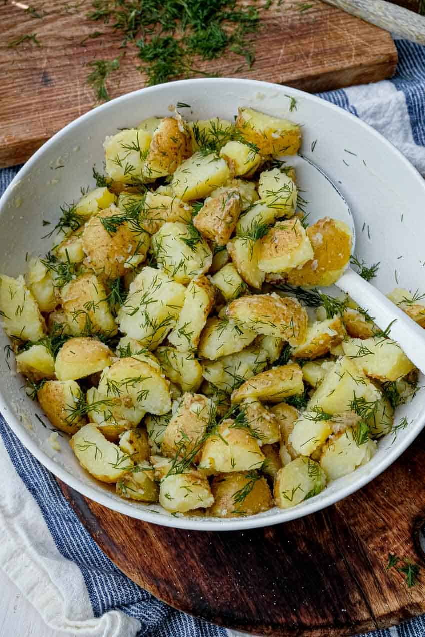 spooning buttery dill potatoes