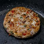 greek chicken patty in pan