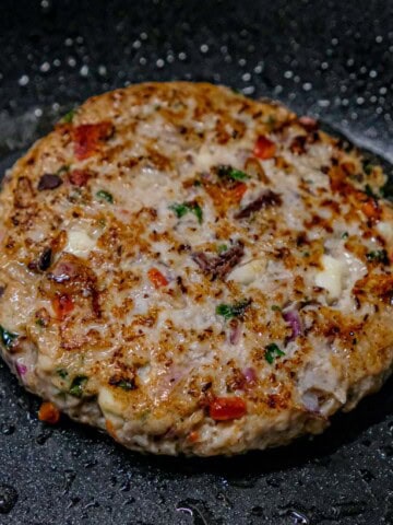 greek chicken patty in pan