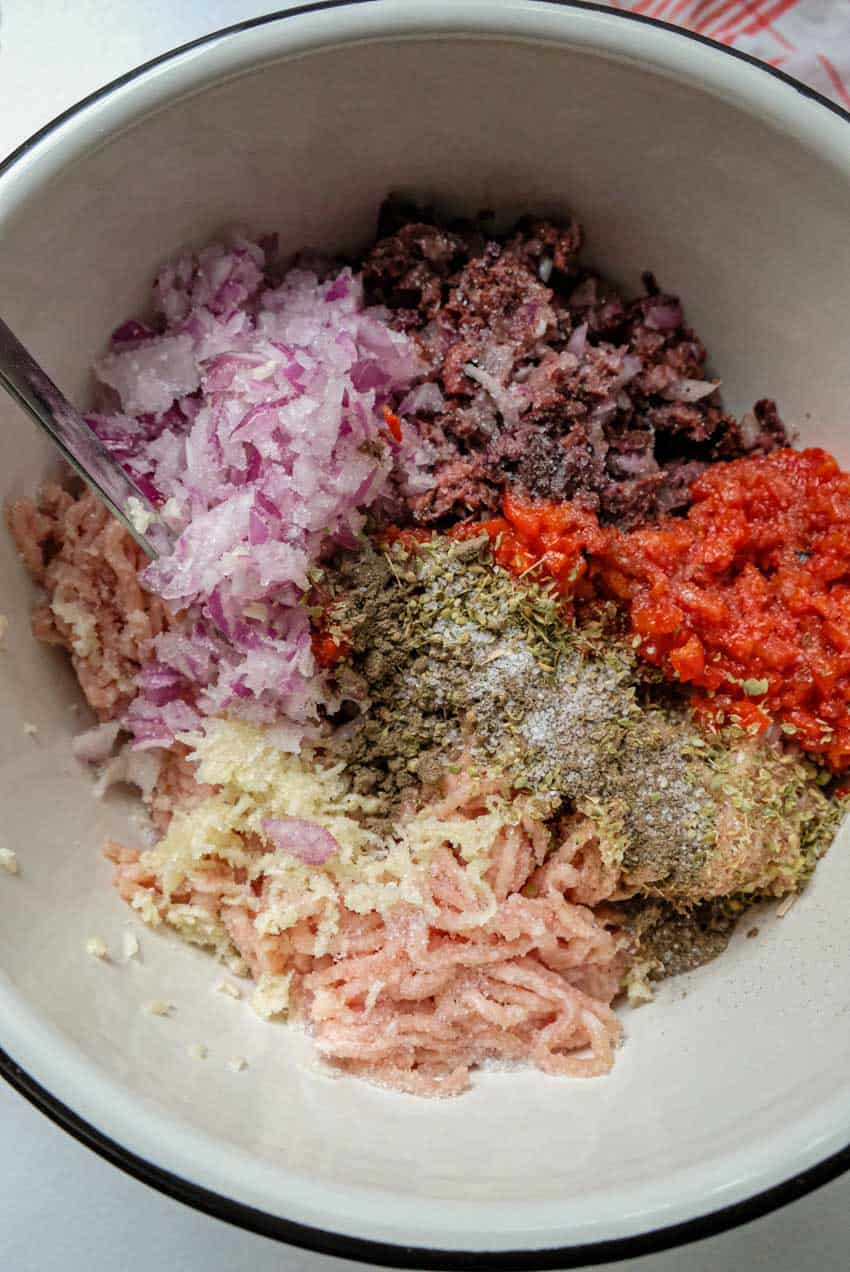 mixing greek chicken patties