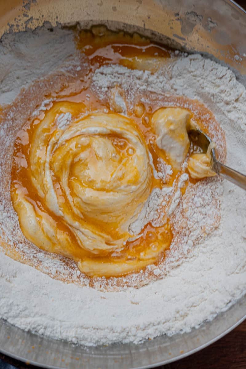 mixing wet into dry ingredients for cozonac