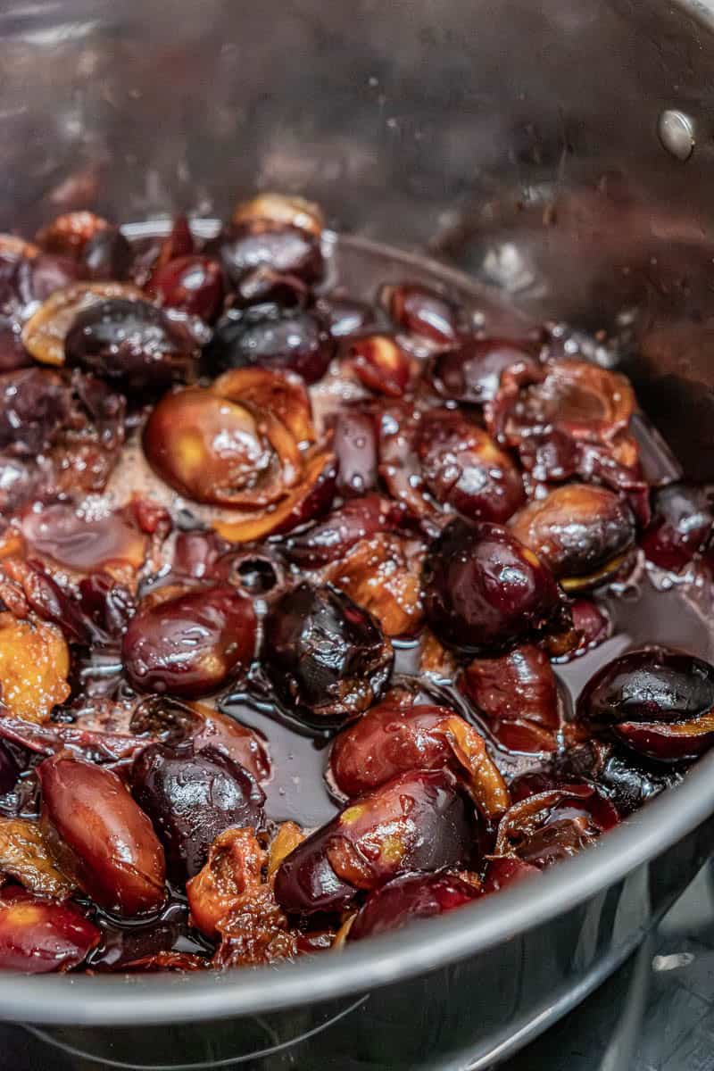 pitted plums in pot