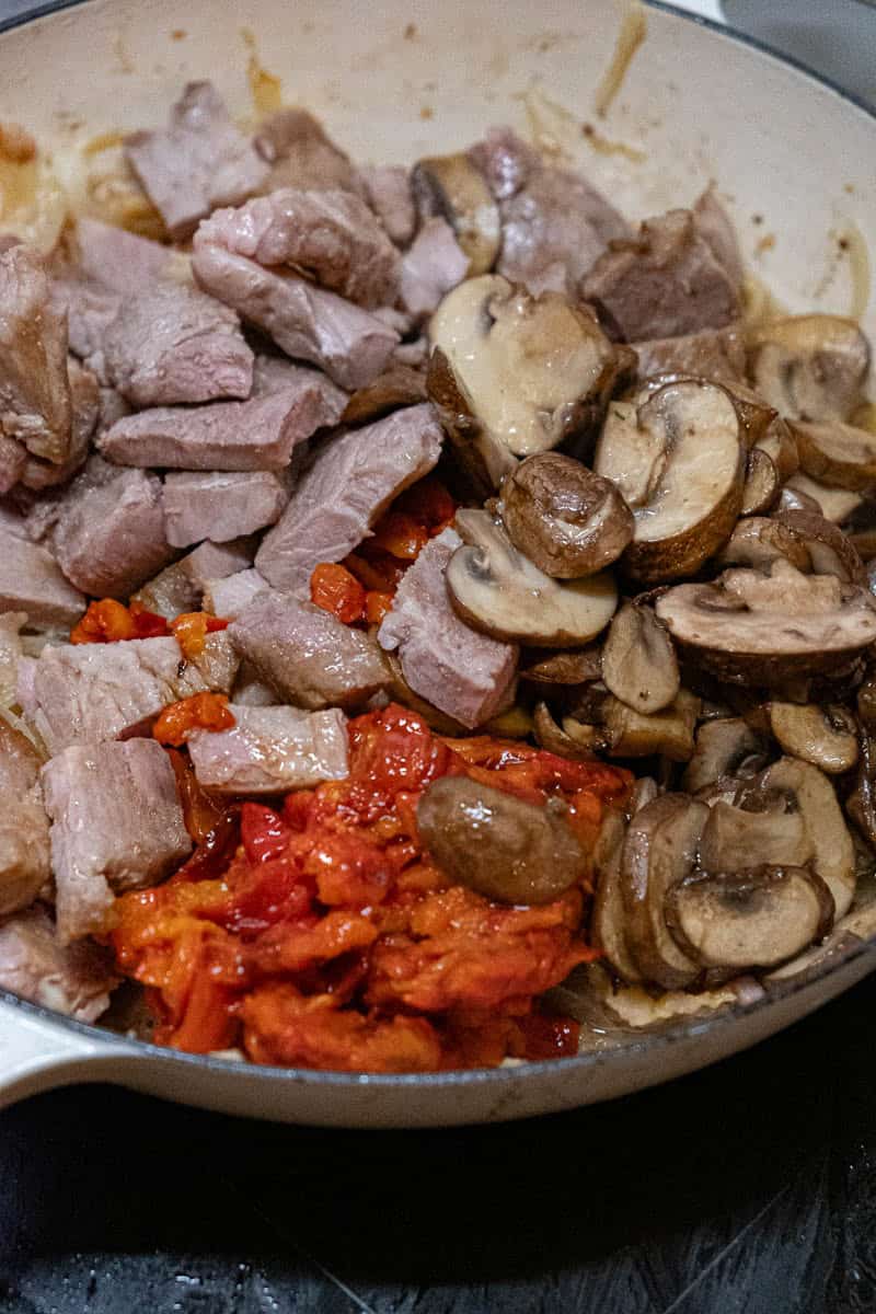 pork mushrooms and peppers in pan