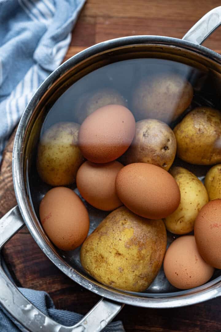 potatoes and eggs in pot