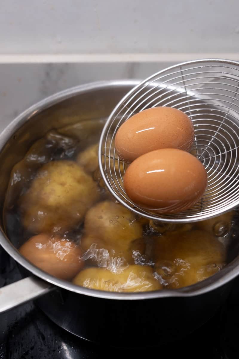 removing eggs from potatoes boiling