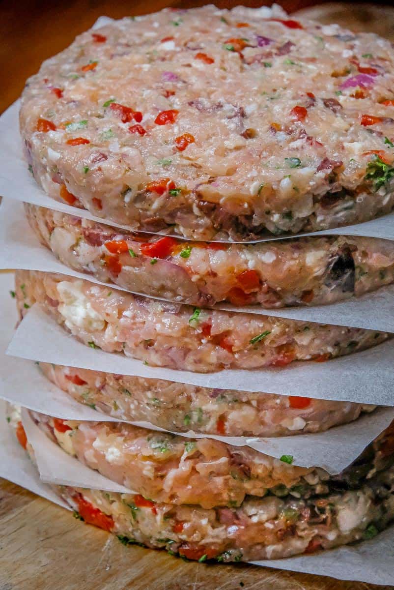 red pepper feta chicken patties in a stack