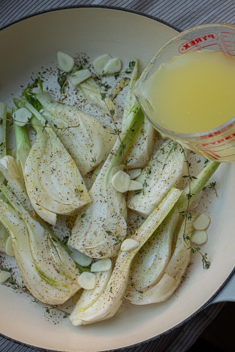 pouring stock as braising liquid for fennel